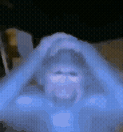 Blurred Person's Face On Blue Background GIF