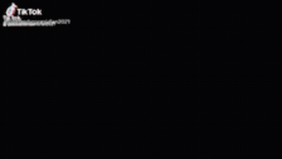 Blurred Person Shadow On Wall With TikTok Logo GIF