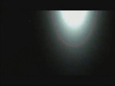 Blurred Person Standing In Front Of Car GIF