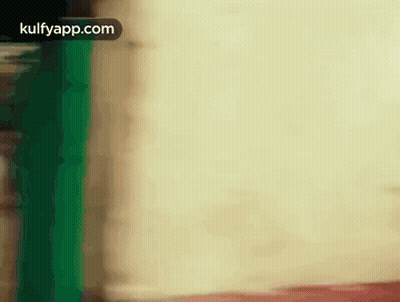 Blurred Person Standing in Front of White Wall