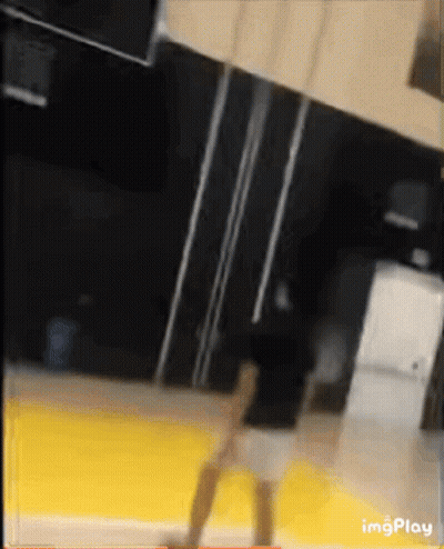 Blurred Person Standing On Yellow Floor With Imgplay GIF