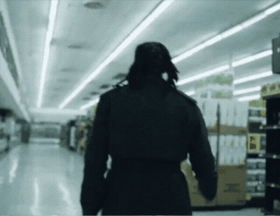 Blurred Person Walking In Store Saying I GIF
