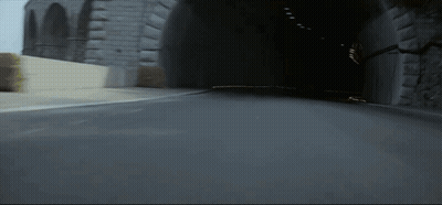Blurred Race Car Driving Down Street GIF