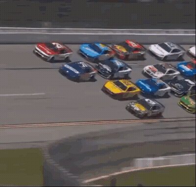 Blurred Race Car Going Down Track GIF