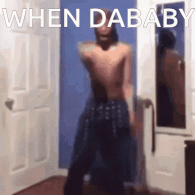 Blurred Shirtless Man Standing In Front Of Door GIF