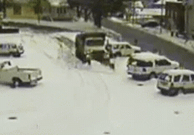 Blurred Snowy Parking Lot With Cars GIF