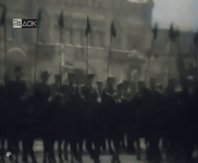 Blurred Soldiers Marching With 24 AOK Sign GIF