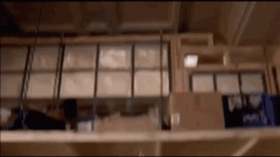 Blurred Warehouse With Shelves Of Boxes GIF