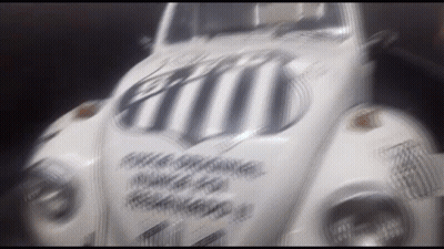 Blurred White Car With Black And White Stripe On Windshield GIF