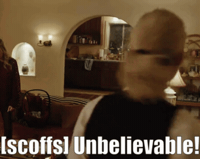 Blurred Woman In Living Room Scoffs Unbelievable GIF