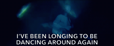 Blurred Woman Saying I've Been Longing To Be Dancing Around Again GIF