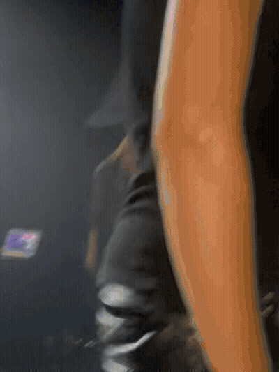 Blurry Arm With Phone In Background GIF