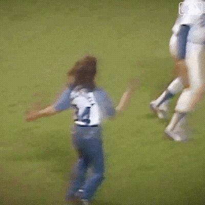 Blurry Baseball Player Throwing Ball To Girl GIF