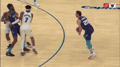 Blurry Basketball Game With Bulls Logo GIF
