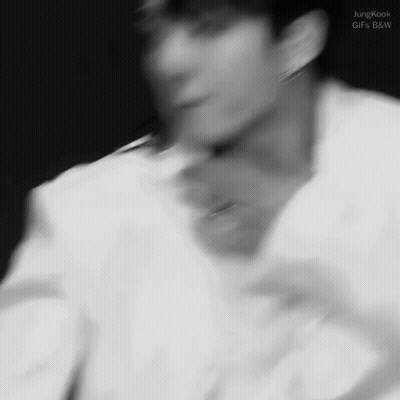 Blurry Black And White Man's Face And Neck GIF