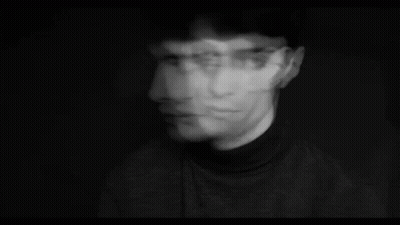 Blurry Black And White Photo Of A Man's Face GIF