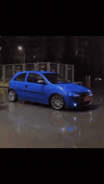 Blurry Blue Toy Car Number 8 GIF