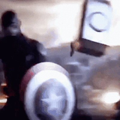 Blurry Captain America Shield With Star In Dark Room GIF