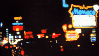 Blurry City At Night With Hollywood Sign GIF