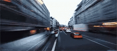 Blurry City Street With Many Cars GIF