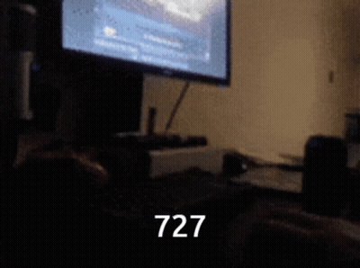 Blurry Computer With Number 727 GIF