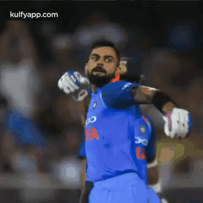 Blurry Cricket Player In Blue Jersey GIF