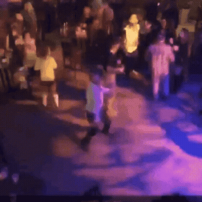 Blurry Crowd Dancing At Party GIF