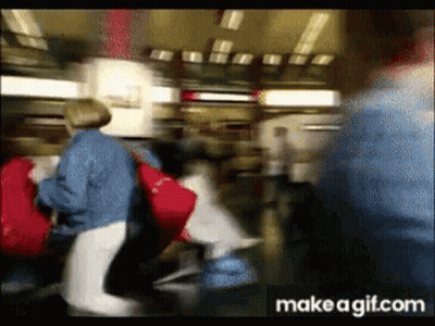 Blurry Crowd Walking In Airport GIF