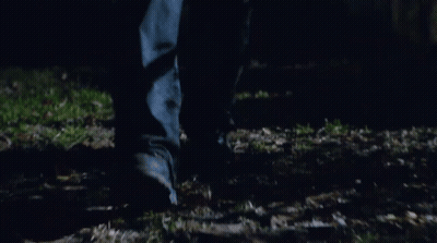 Blurry Feet Walking Through Grass GIF