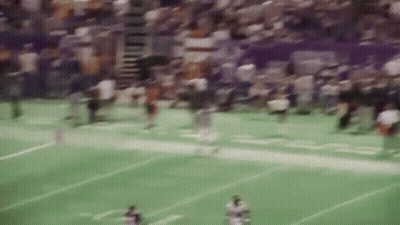 Blurry Football Game In Stadium With Crowd GIF