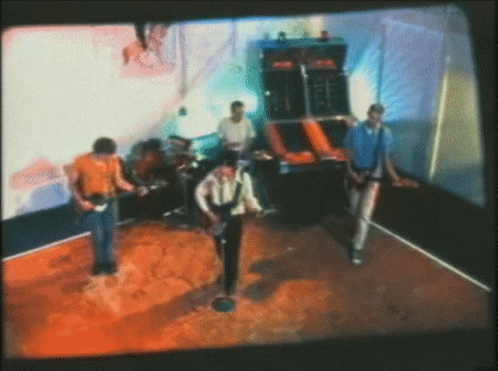 Blurry Group Of Men Playing Guitars GIF