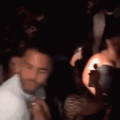Blurry Group Of People Dancing In Club GIF