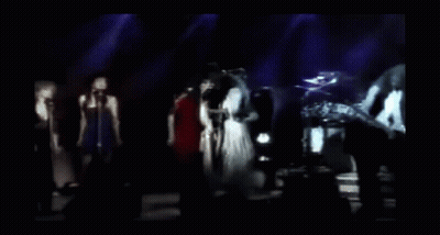 Blurry Group Singing On Stage GIF