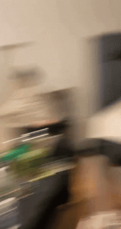 Blurry Hand Holding Bottle GIF
