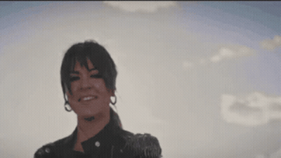 Blurry Hand Reaching For Sun GIF