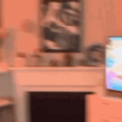 Blurry Living Room With Television And Fireplace GIF