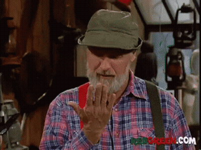Blurry Man By Brick Wall Hugging Another Man GIF