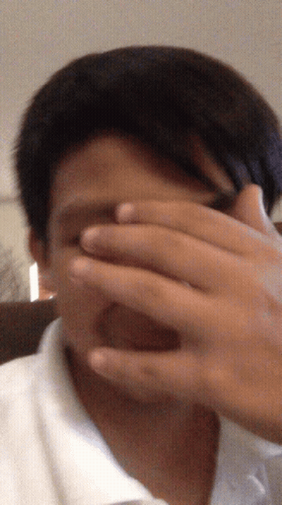 Blurry Man Covering Face GIF