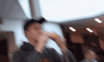 Blurry Man Covering Face With Hand GIF
