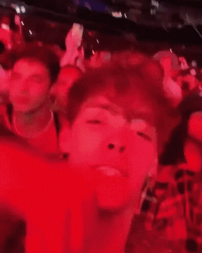 Blurry Man Face In Crowded Room GIF