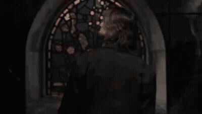 Blurry Man Holding Gun In Front Of Window GIF