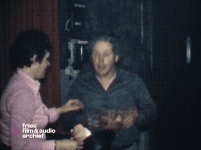 Blurry Man Holding Gun In Front Of Window GIF