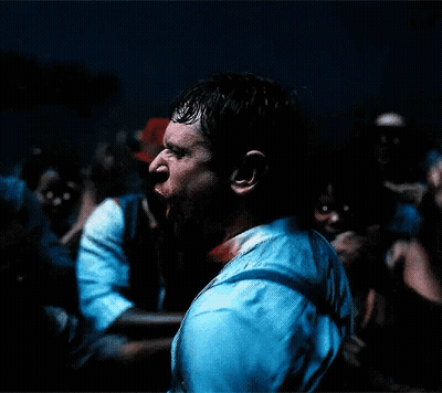 Blurry Man Holding Microphone In Dark Room GIF