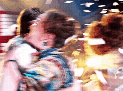 Blurry Man Holding Woman In Arms GIF
