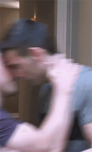 Blurry Man In Baseball Cap GIF