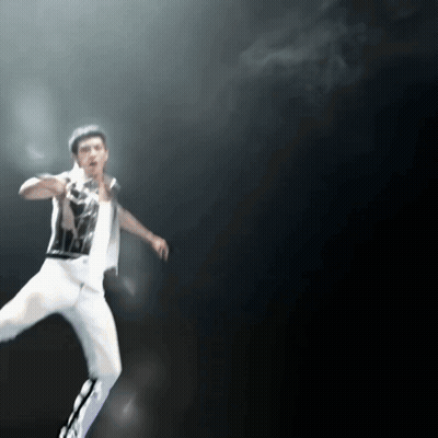 Blurry Man In Black And White Shirt And White Pants GIF