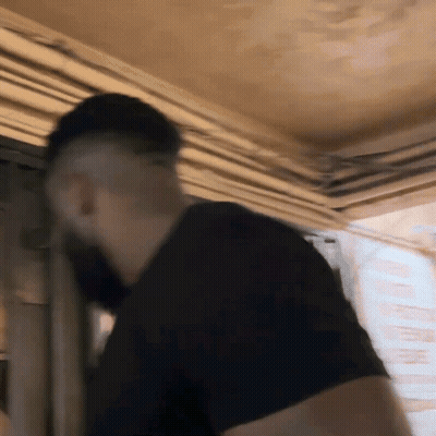 Blurry Man In Black Shirt With Beard GIF