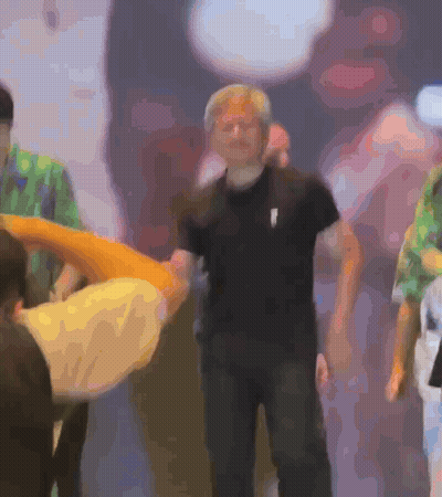 Blurry Man In Black Shirt With White Arrow GIF