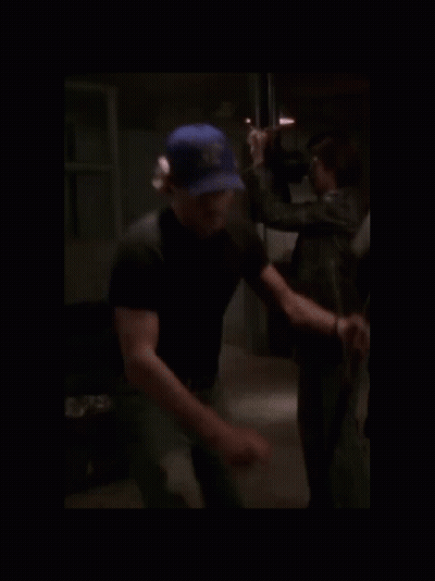 Blurry Man In Blue Hat Saying U.S. Navy GIF