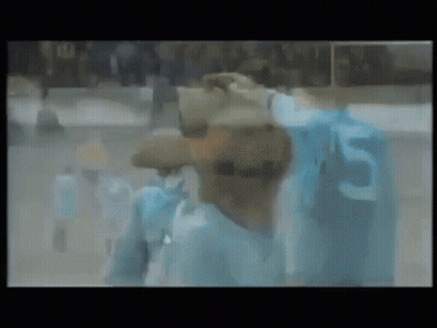 Blurry Man In Blue Shirt With Number 5 GIF